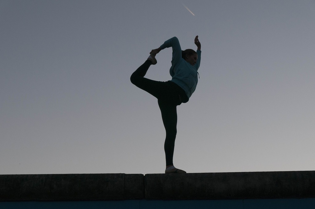 woman stretching dusk sunrise yoga silhouette-607905_1920